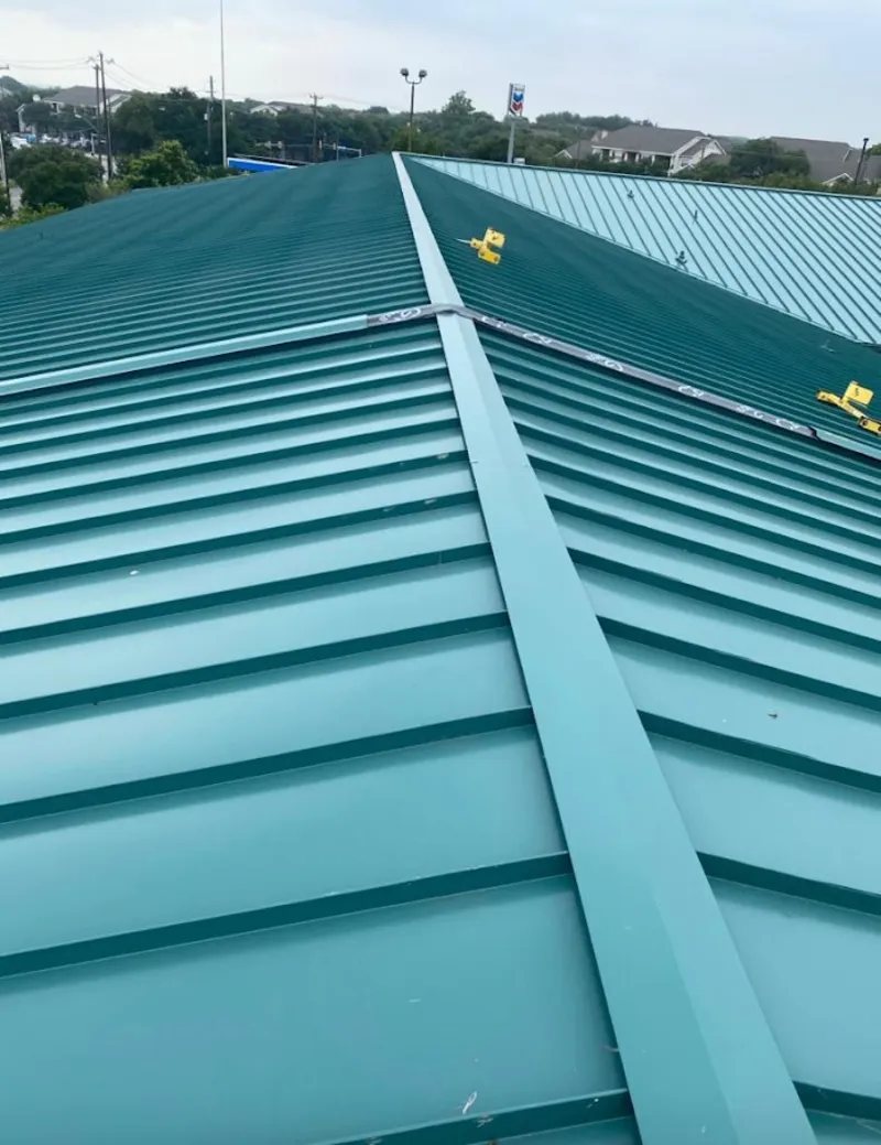 Green commercial metal roof ridge and valley for Metal Roof Repair in Grand Ledge